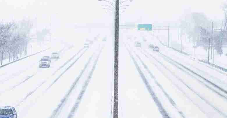 Symmetrical Photo Of The Highway During A Snowstorm
