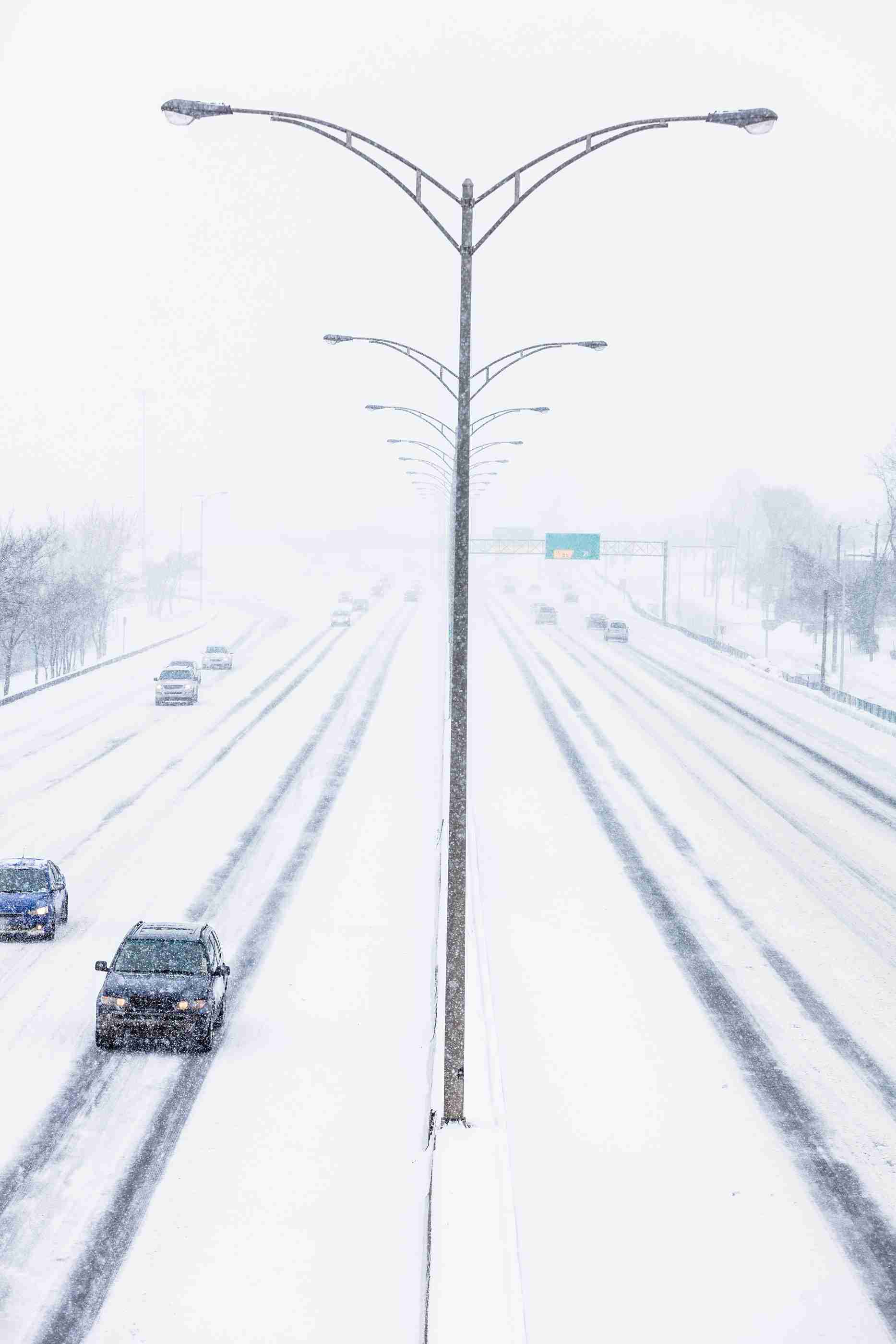 Symmetrical Photo Of The Highway During A Snowstorm