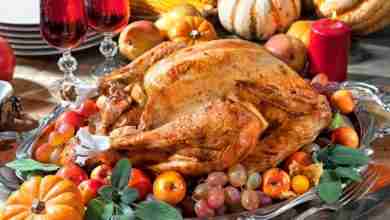 Thanksgiving dinner. Roasted turkey on holiday table with pumpki