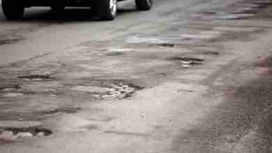 Very bad quality road with potholes