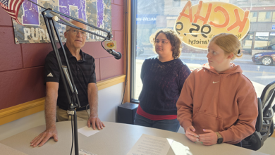Charles City Mayor Dean Andrews, Charles City High School students Brynlee Bergeson & Devony O'Brien.